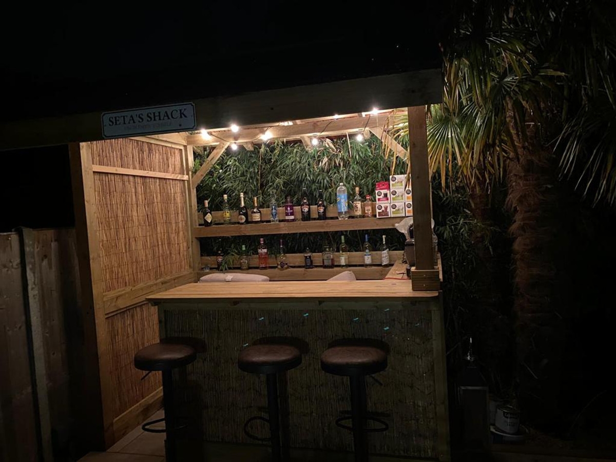 Outdoor bar area with exterior lighting